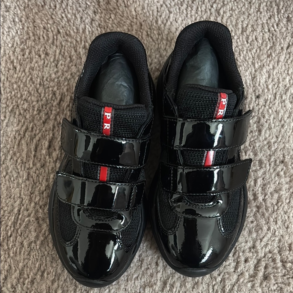 Prada Black Patent Leather Velcro Sneakers with Red Stripe